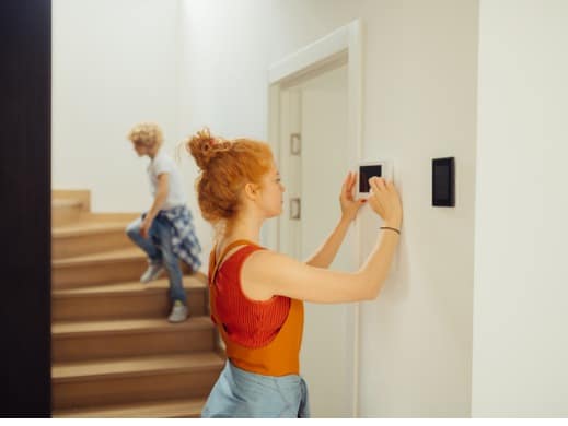 Woman thermostat stairs
