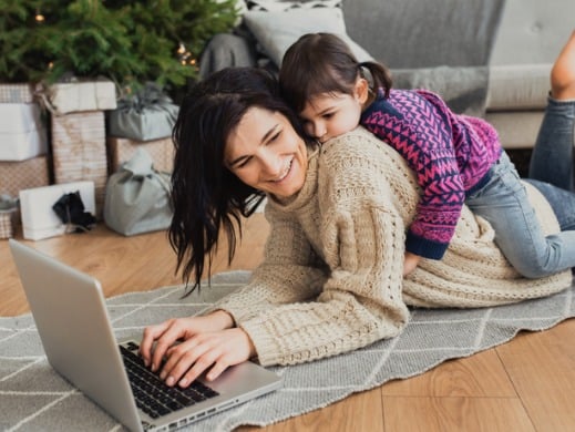 Woman and daughter shopping online