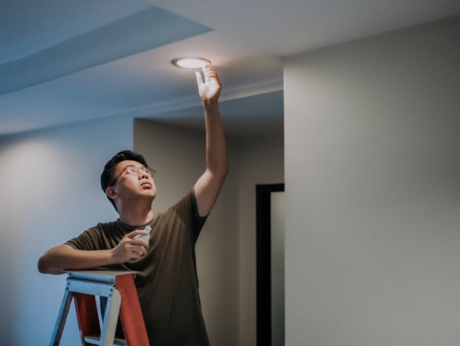 Man changing a light bulb